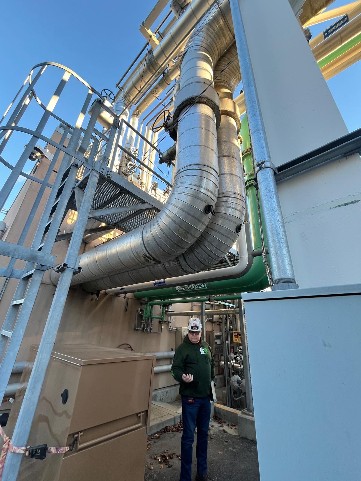 Ecostep crew member beside overhead process ducting